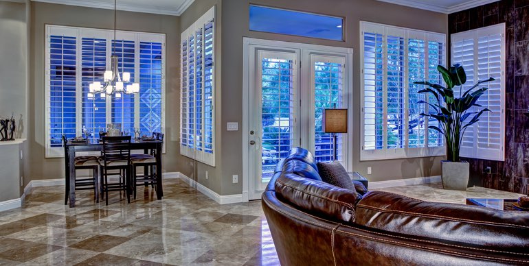 Las Vegas great room with classic shutters and modern lighting.